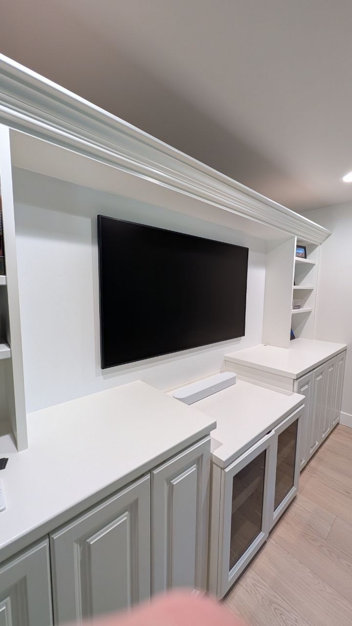 Samsung Frame TV mounted in custom built-in cabinets with Sonos soundbar and hidden wires in Arden, CA